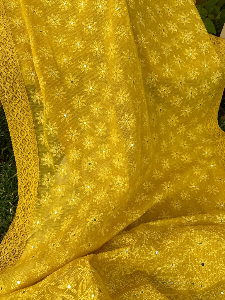 yellow doria kota chikankari saree with mirror work and lace edging