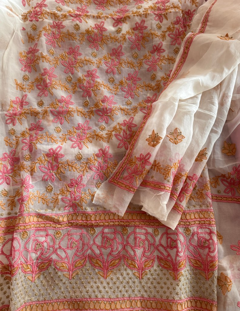 Off-white pure organza chikankari kurta dupatta set with peach & pink shadow & murri work