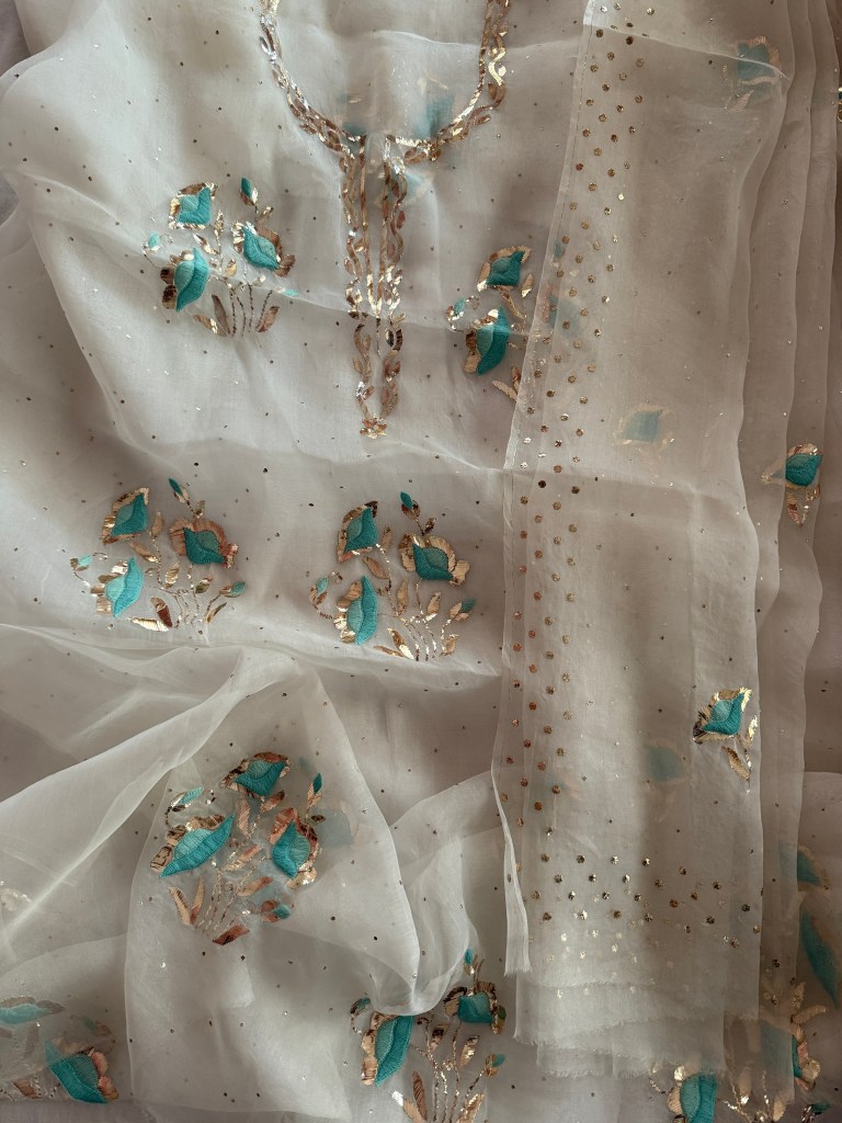Off-white pure organza kurta dupatta set with hand crafted gara work, mukaish work and Pitta work