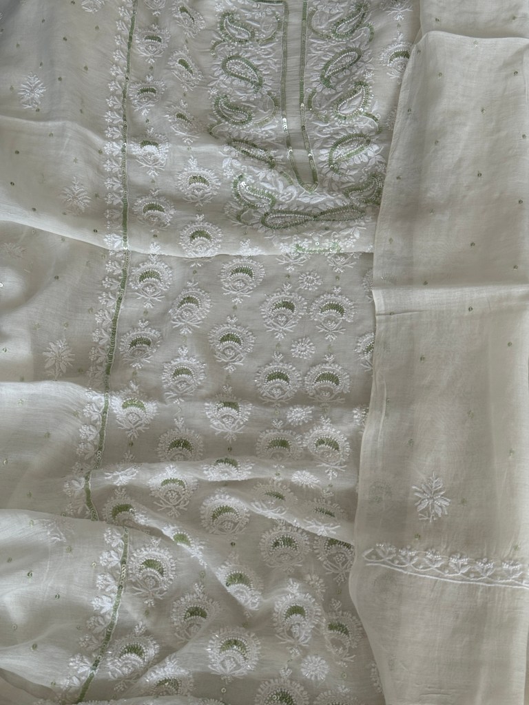Ivory white Chanderi mulmul chikankari kurta dupatta set delicately embellished with tiny pearls & green sequins