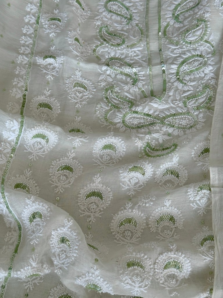 Ivory white Chanderi mulmul chikankari kurta dupatta set delicately embellished with tiny pearls & green sequins