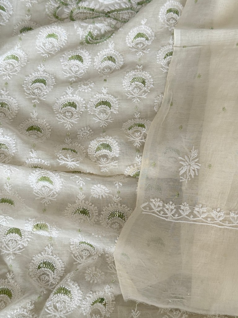 Ivory white Chanderi mulmul chikankari kurta dupatta set delicately embellished with tiny pearls & green sequins