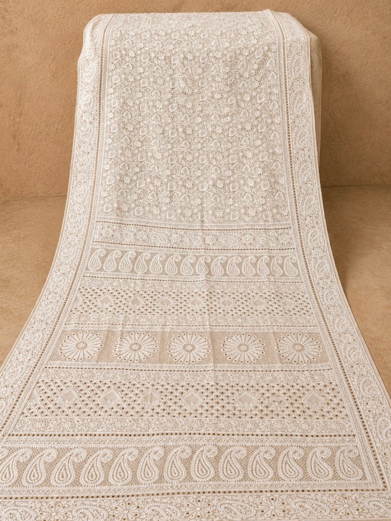 Ivory & gold pure georgette Jaali work jaal Chikankari saree with blouse. A master craftsman piece.